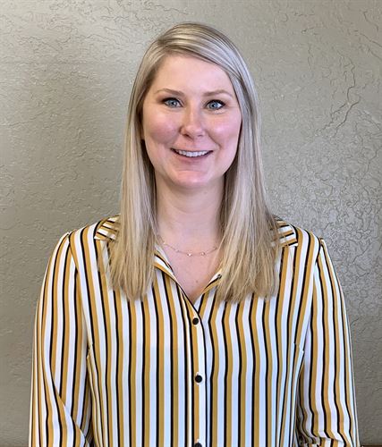 A woman wearing a striped shirt